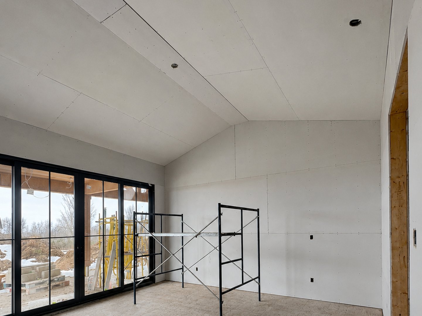 Angled ceiling and glass wall